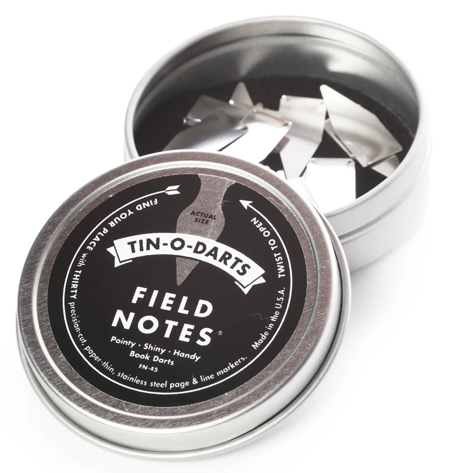 Circular tin of Field Notes book darts