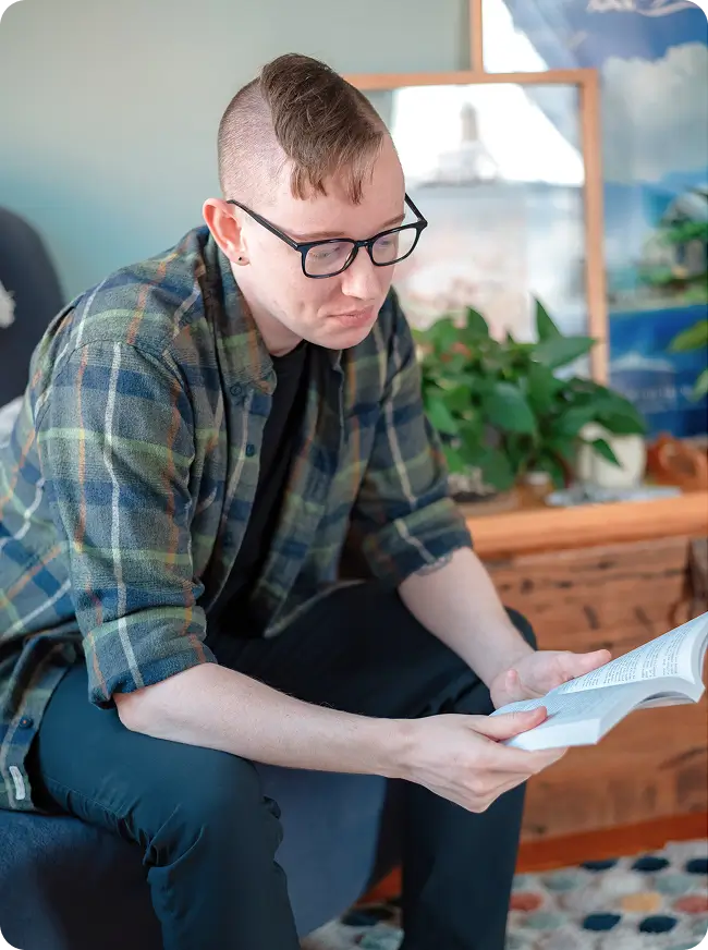 Lewis Jorstad holding a copy of Mastering Character Arcs